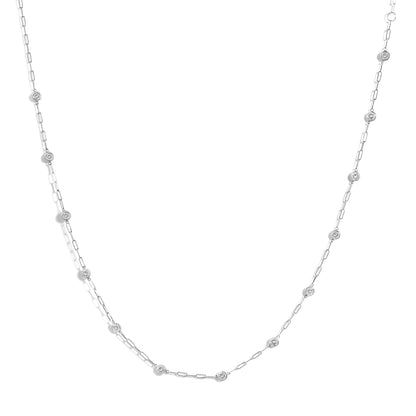 White necklace with elongated chain links and round white gemstones in bezel settings along the chain, shown from a top-down angle on a white background.