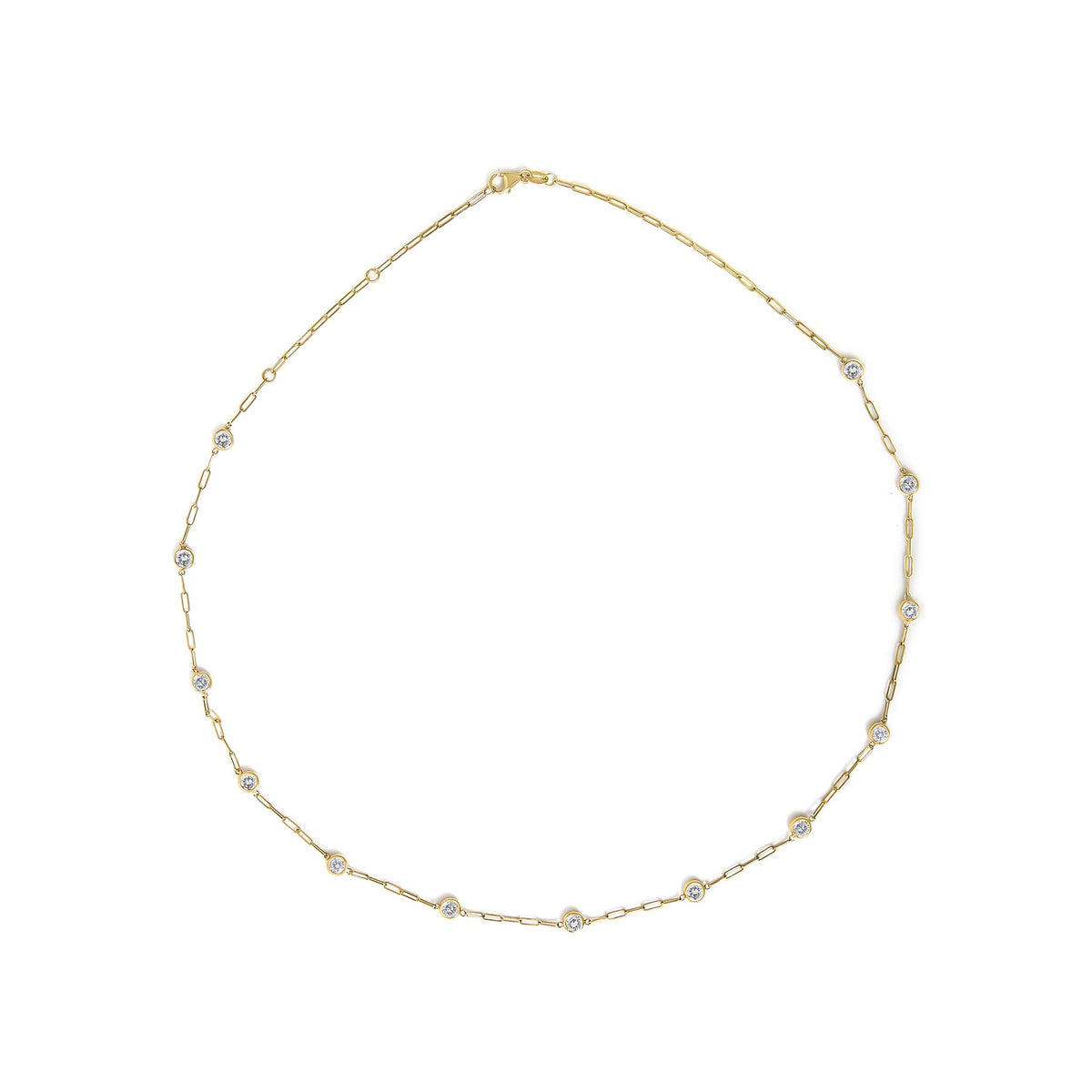 Yellow necklace with round white gemstones in bezel settings, shown flat in a top-down angle.