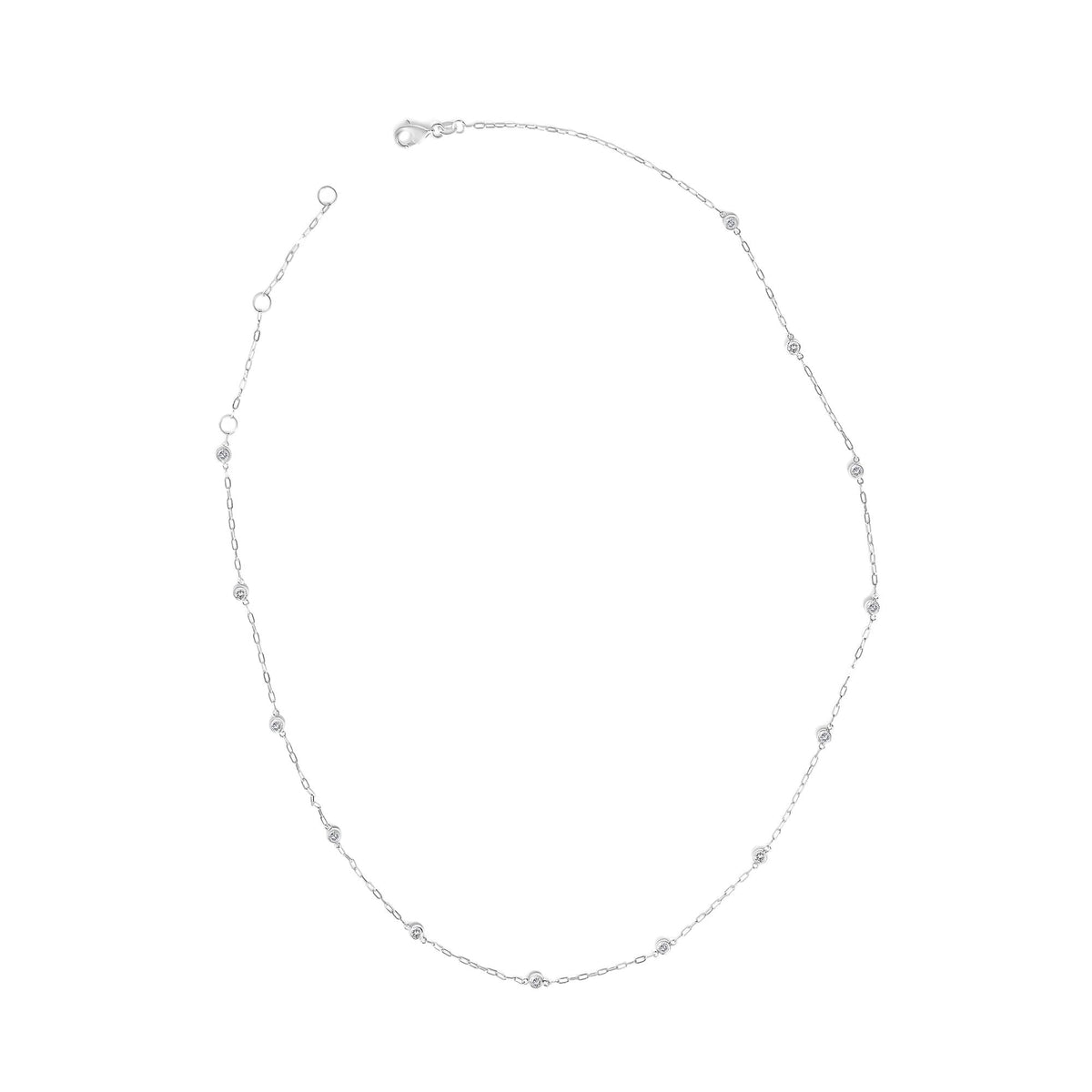 Close-up front view of a white metal necklace featuring small round white gemstones in bezel settings evenly spaced along a delicate chain, shown on a white background.