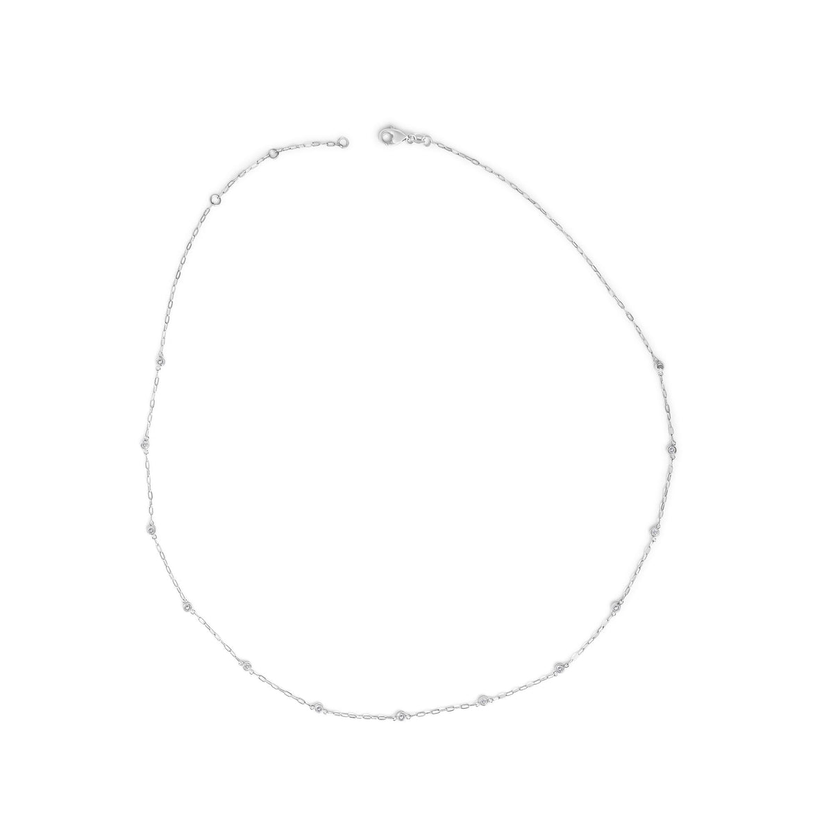 Top-down view of a white metal necklace with round white gemstones in bezel settings spaced along a delicate chain, shown laid flat on a white background.