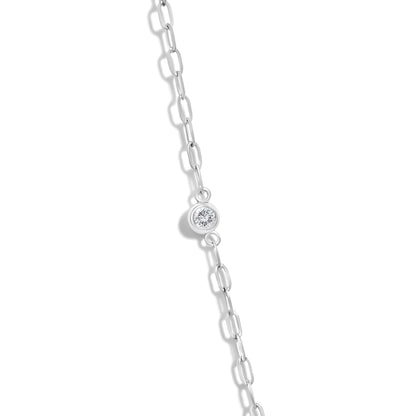 Close-up of 14K gold 1/4 cttw diamond paperclip station necklace showcasing a bezel-set round diamond on white background