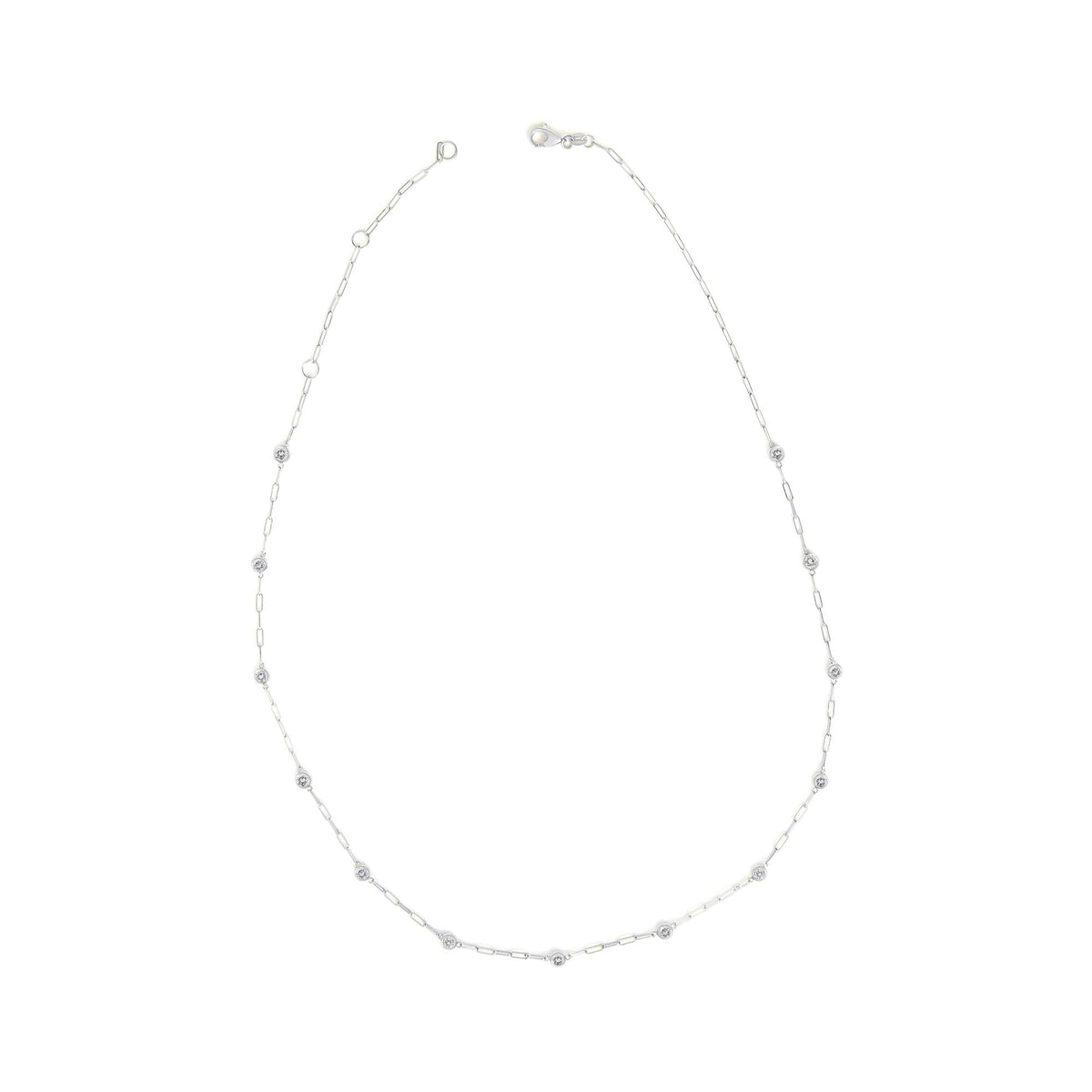 White necklace shown on a white background, viewed from the top with fine link chain and round white gemstones in bezel settings spaced evenly along the chain.