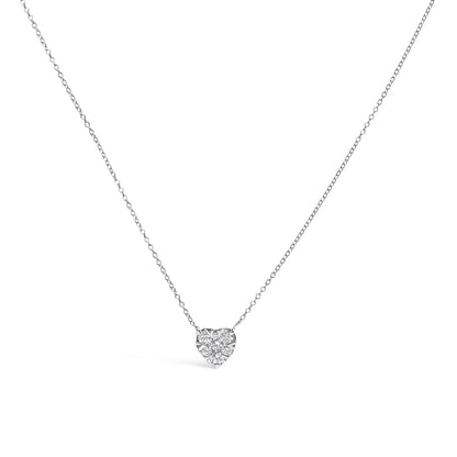 Close-up front view of a white necklace with a heart-shaped pendant featuring multiple round white gemstones in an invisible setting on a fine chain.