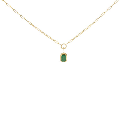 Front view of a yellow metal necklace with a chain link design and a rectangular green gemstone pendant in bezel setting.