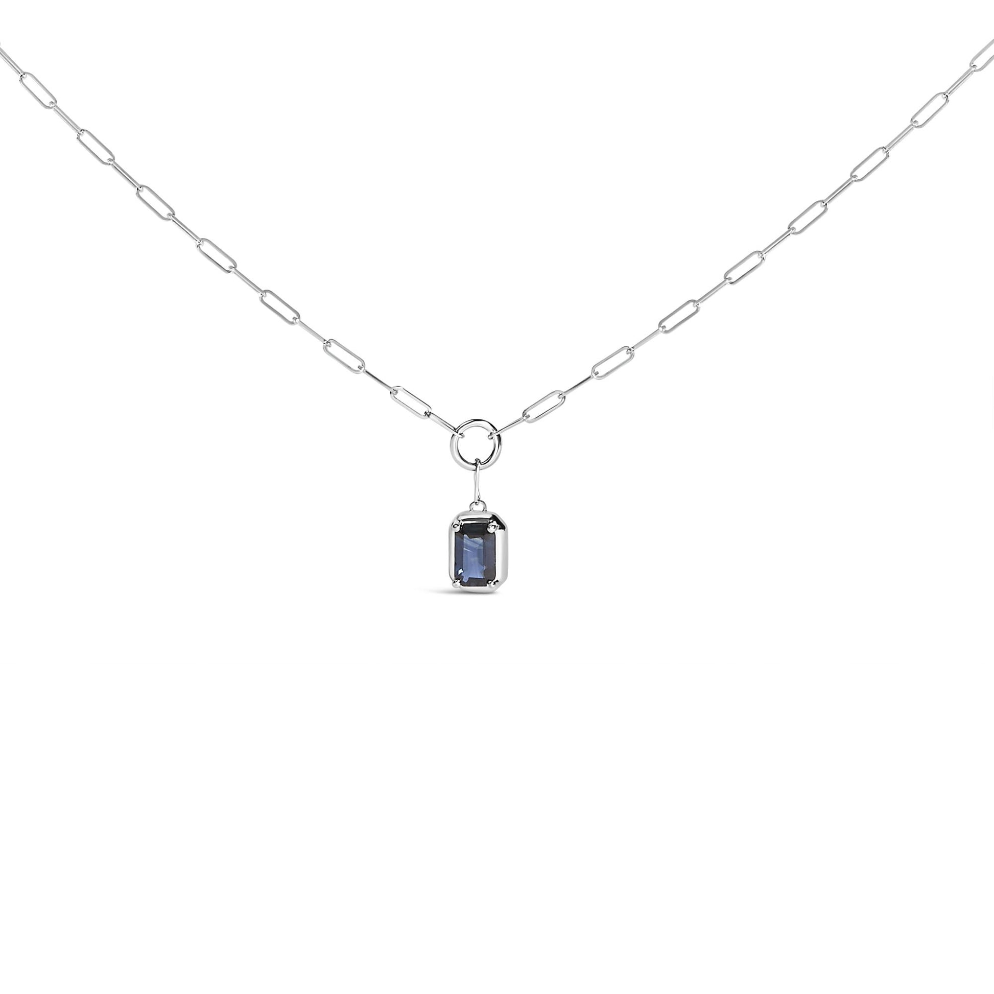 Front view of a white metal necklace with a rectangular blue gemstone in a bezel setting hanging from a chain with elongated links.