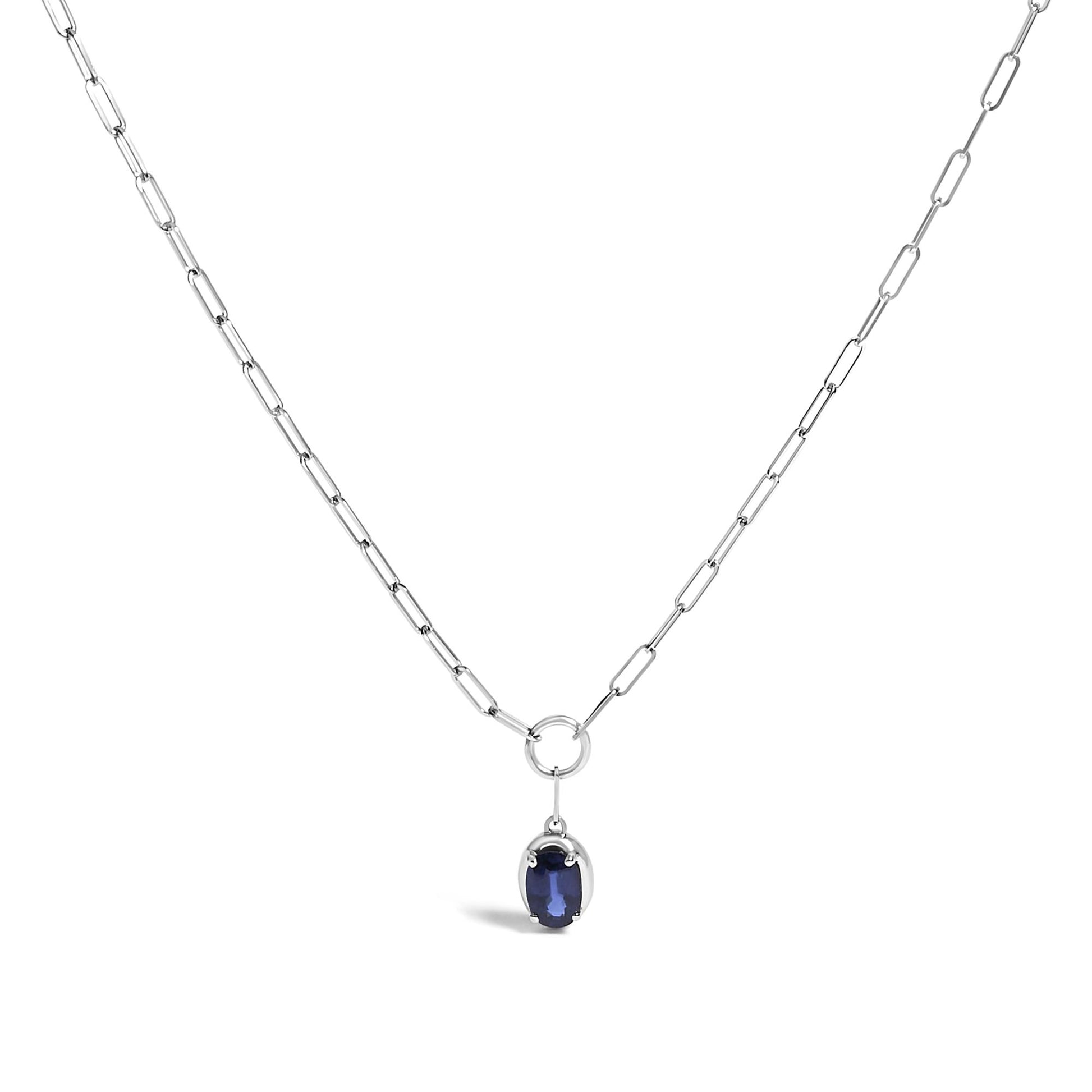 White metal necklace with elongated chain links and a small oval blue gemstone pendant, shown on a white background from a front angle.