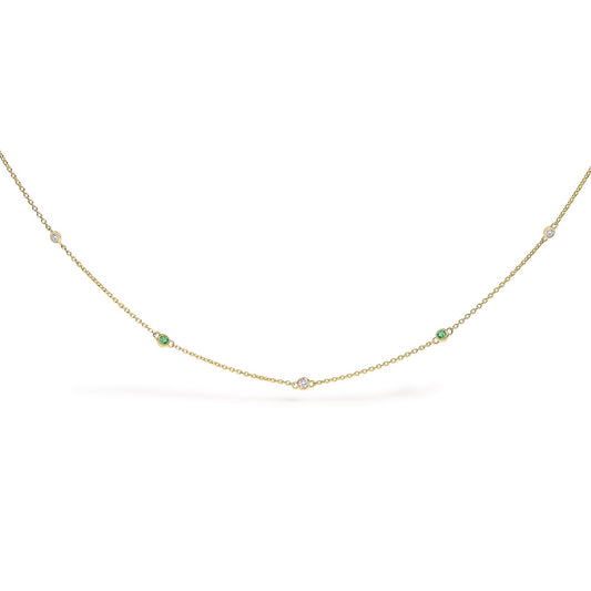 Yellow necklace with alternating round white and green gemstones in bezel settings, shown flat on a white background from a front angle.