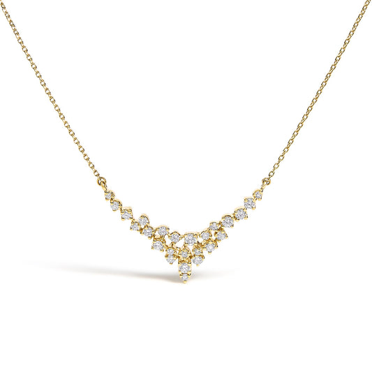 Front-facing close-up of a yellow metal necklace with a V-shaped cluster of round white gemstones in prong settings.