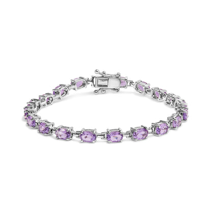 White bracelet featuring oval purple gemstones in four-prong settings, shown from a front angle.