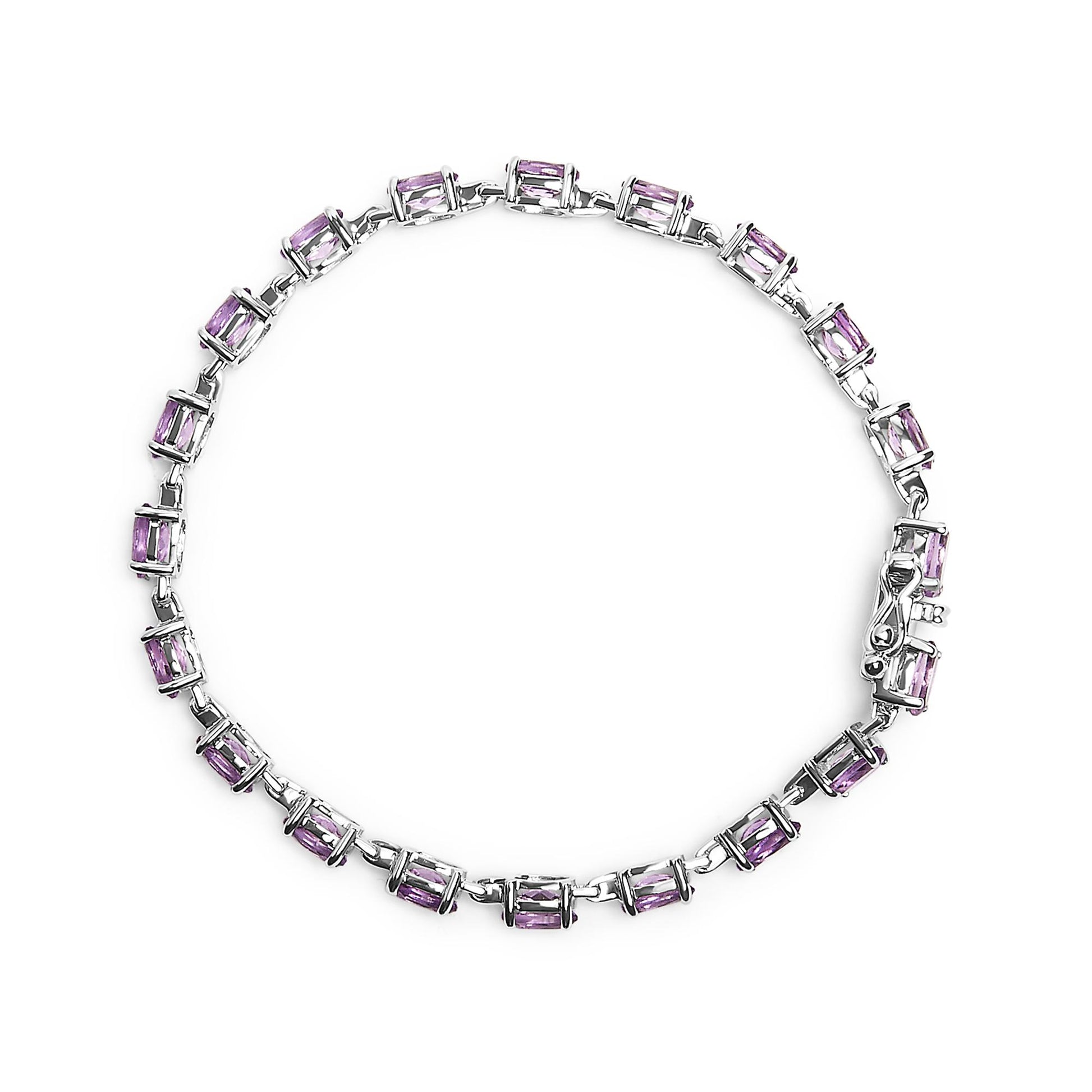 White metal bracelet with oval purple gemstones in 4-prong settings, shown in a flat lay top-down view.