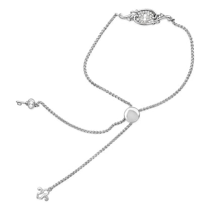 Close-up front angle of a white bracelet with a chain and a round slider, featuring an ornate oval detail with round white gemstones in a shared prong setting.
