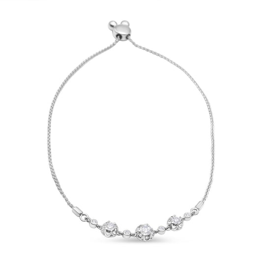 White metal bracelet with round white gemstones in prong settings, viewed from the front on a white background.