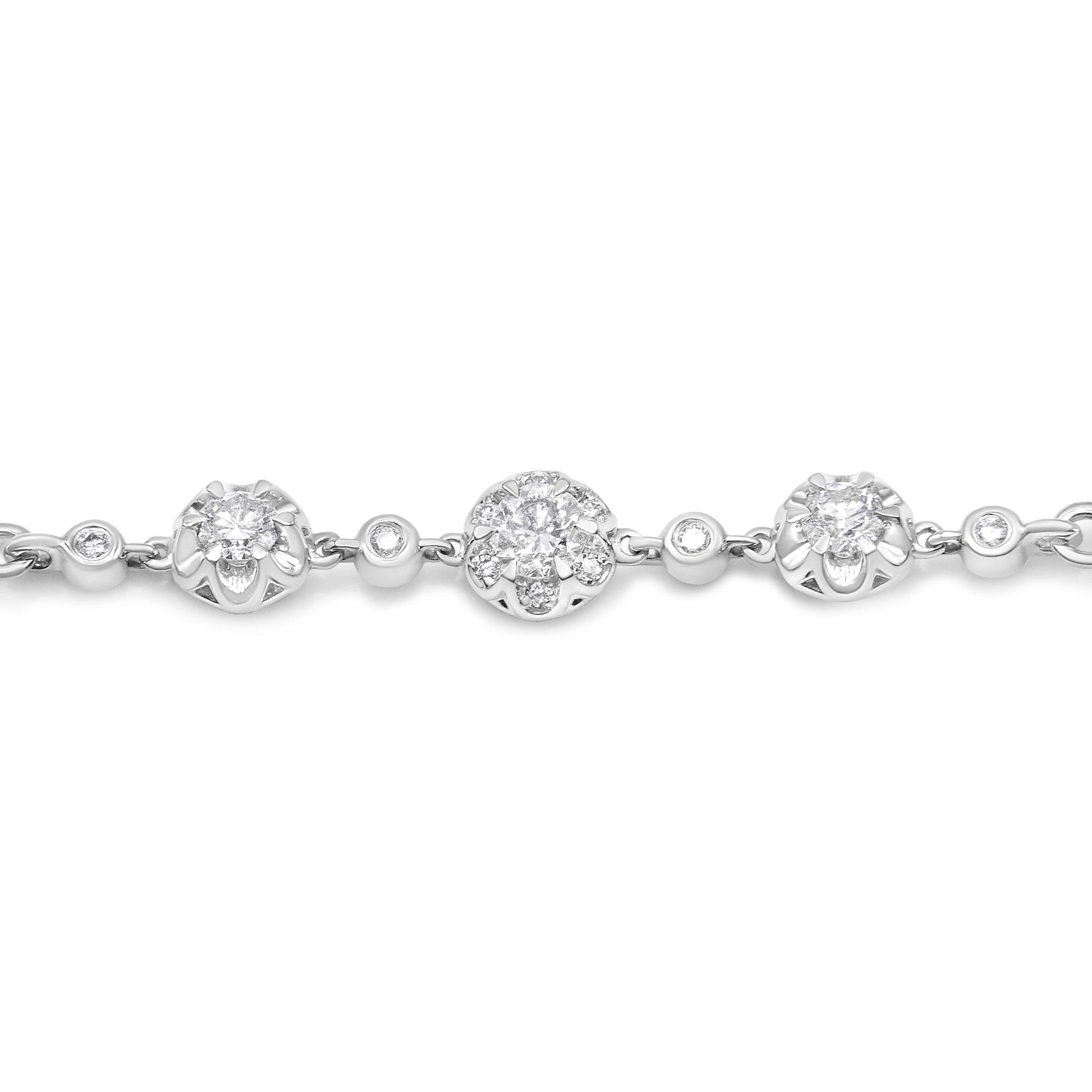 Close-up of white metal bracelet with alternating round prong-set white gemstones and clusters of white gemstones arranged in floral patterns, photographed from the front.