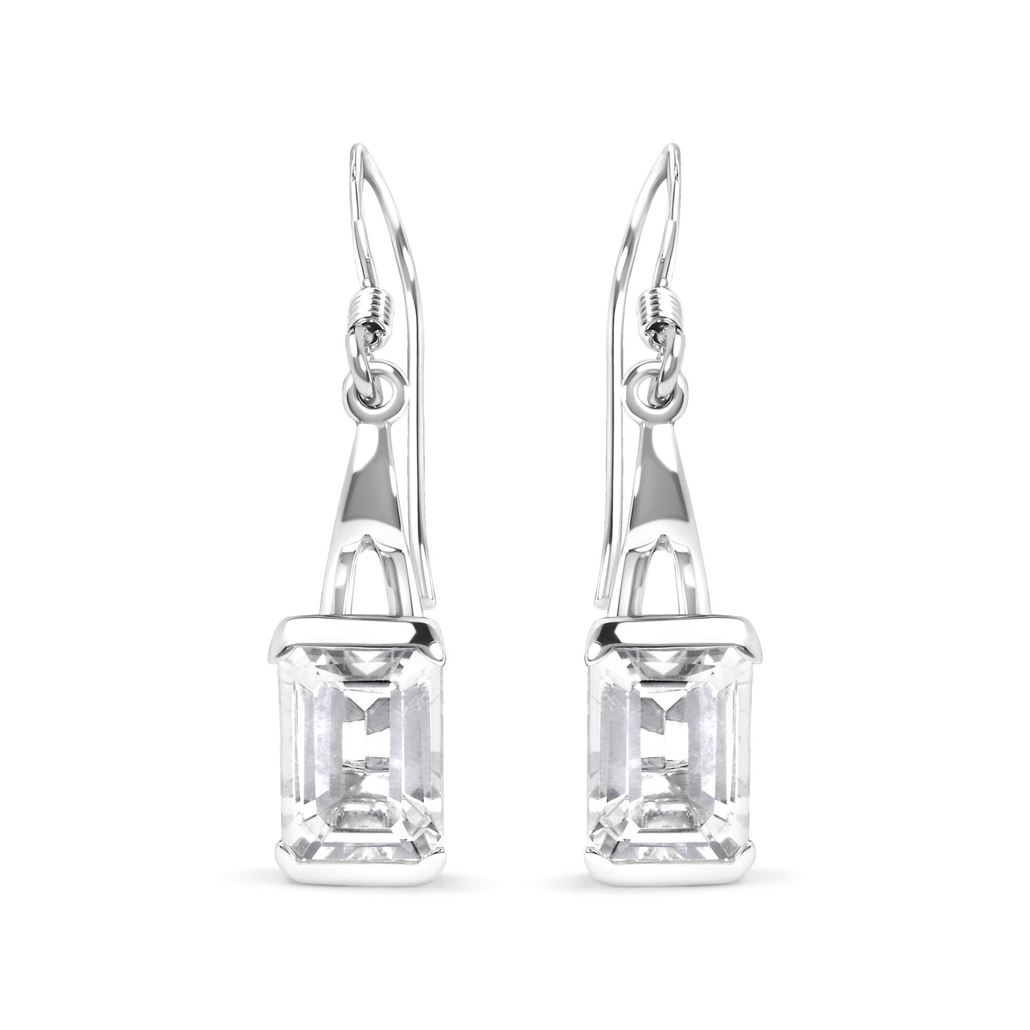 Front-facing image of white metal earrings with emerald-cut white gemstones in four-prong settings hanging from hooks.