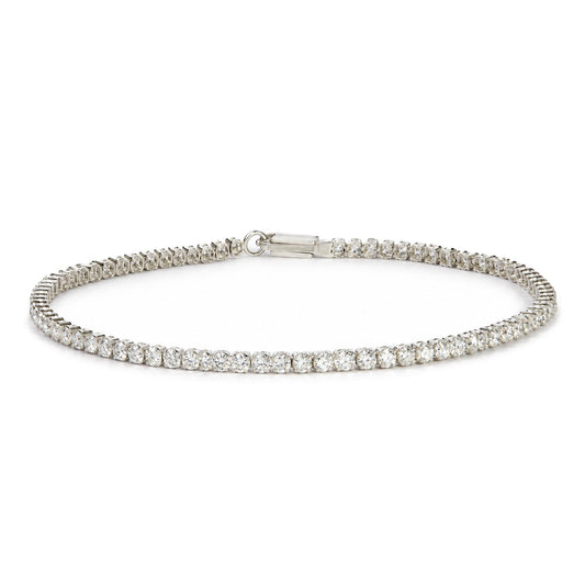 White bracelet with round white gemstones in prong settings, shown flat on a white surface, close-up front angle view.