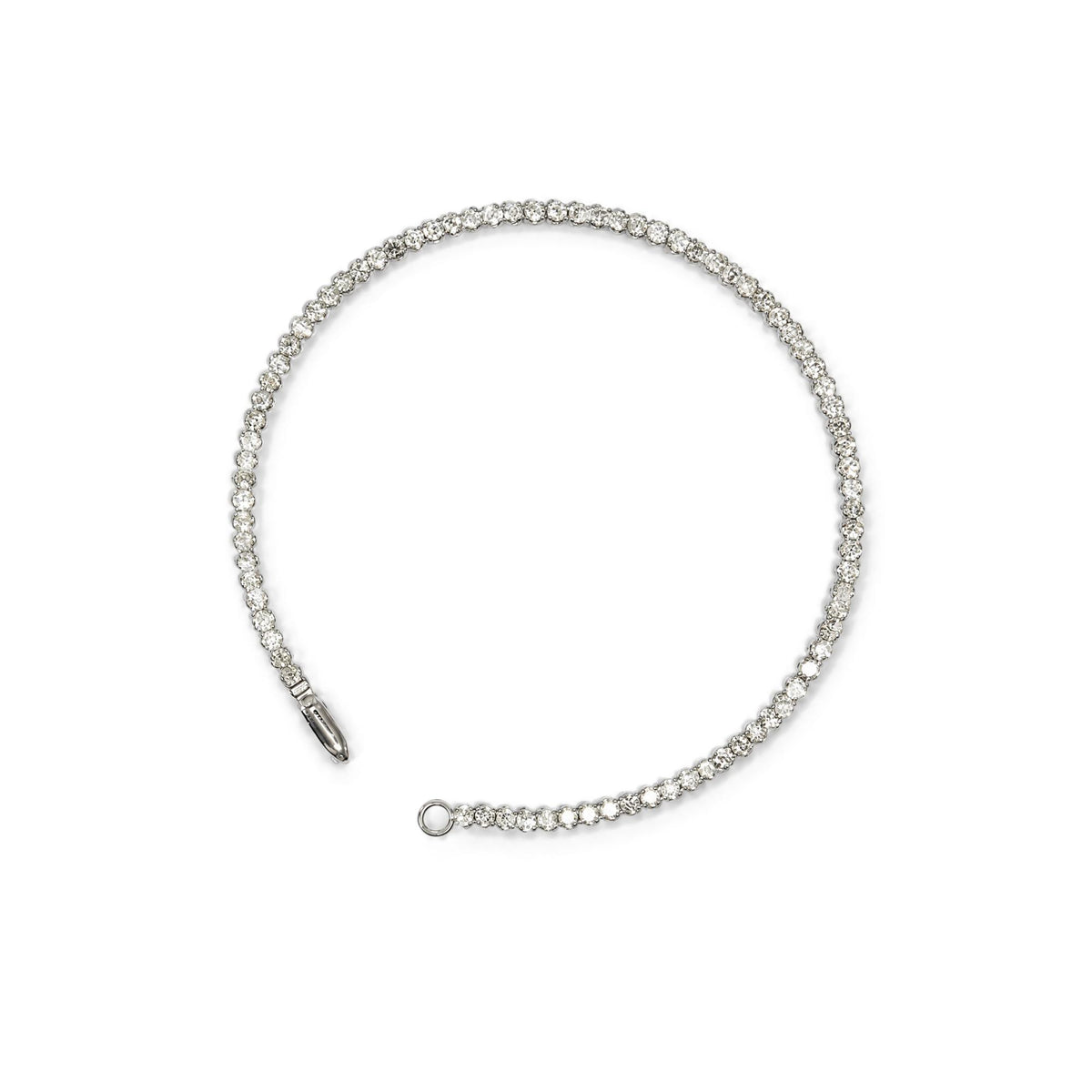 White metal bracelet with round white gemstones in prong settings, shown flat on a white background from a top-down angle.