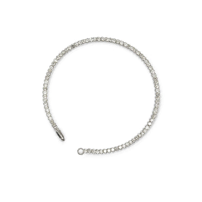 White metal bracelet with round white gemstones in prong settings, shown flat on a white background from a top-down angle.