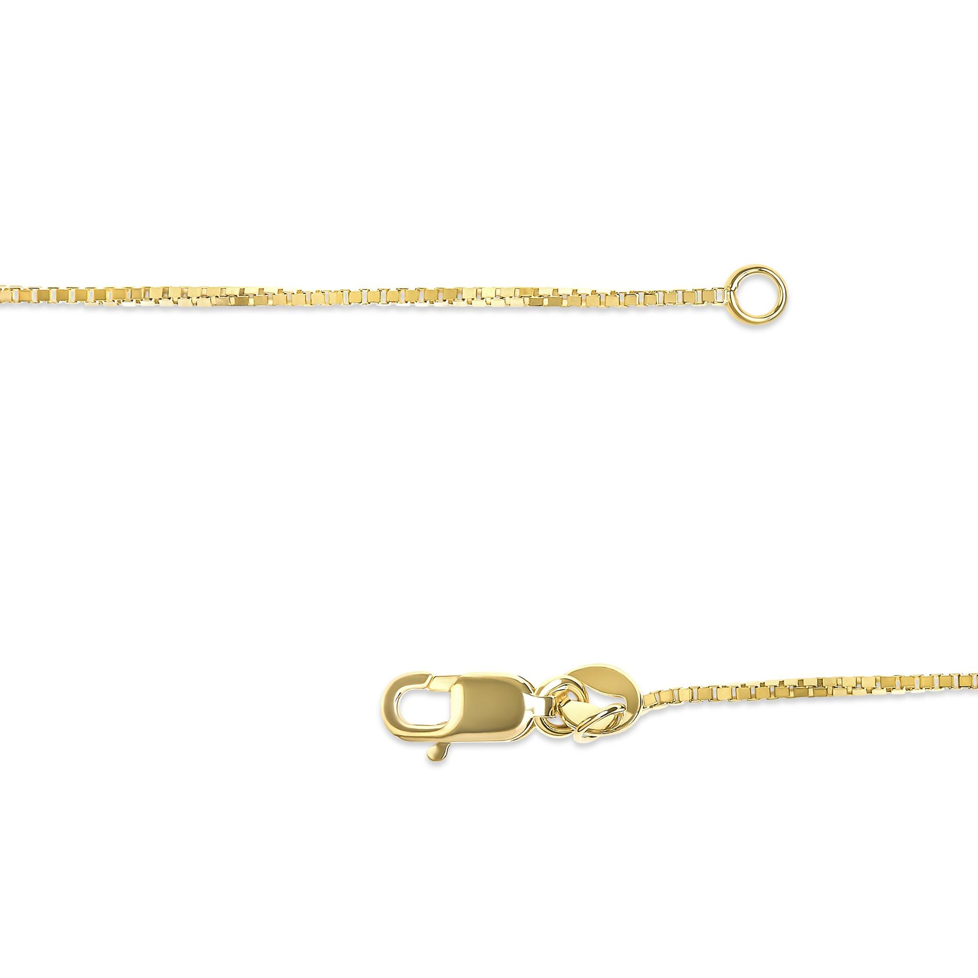 Close-up shot of a yellow metal chain with a lobster clasp and circular ring on a white background.