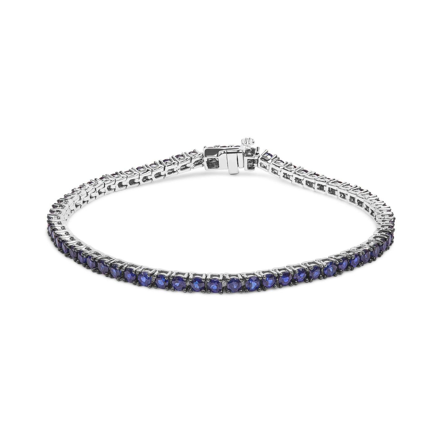 White metal bracelet with round blue gemstones in a shared prong setting, shown from a slightly elevated front angle.