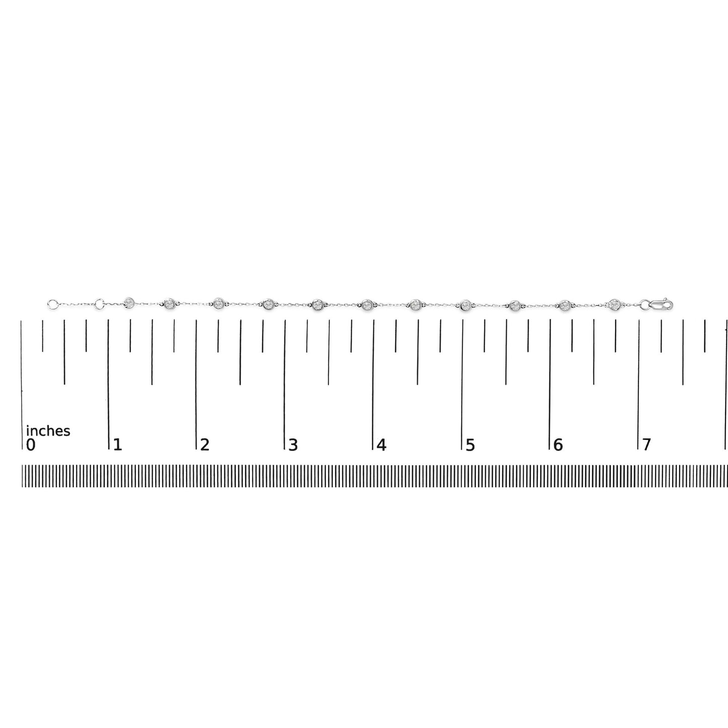 White metal bracelet with round bezel-set white gemstones, shown on a scale from a top-down angle.