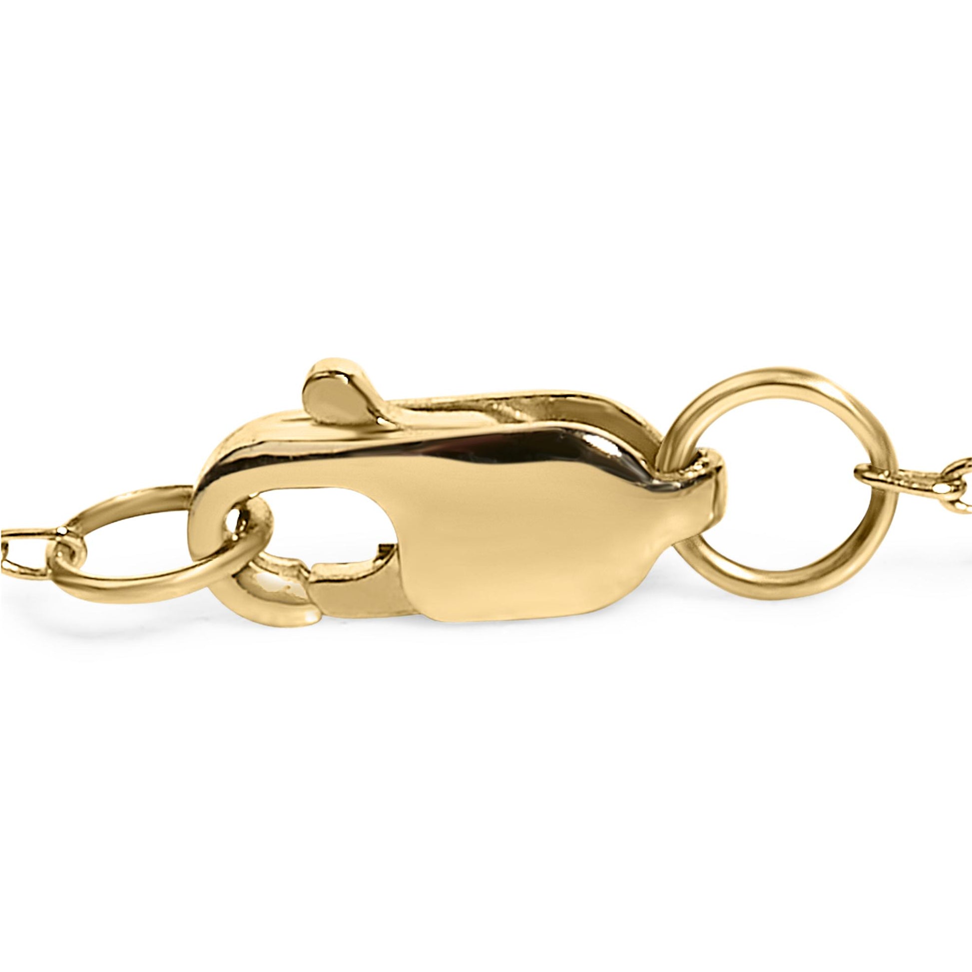 Close-up side view of a yellow metal bracelet clasp with attached chain links.