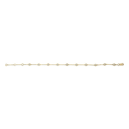 Yellow metal bracelet with evenly spaced round white gemstones in bezel settings, shown flat from a top-down angle.