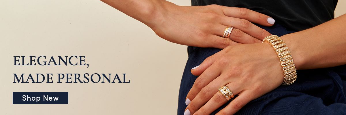 Close-up of hands wearing gold rings and bracelets with text 'Elegance, Made Personal' and 'Shop New' button.