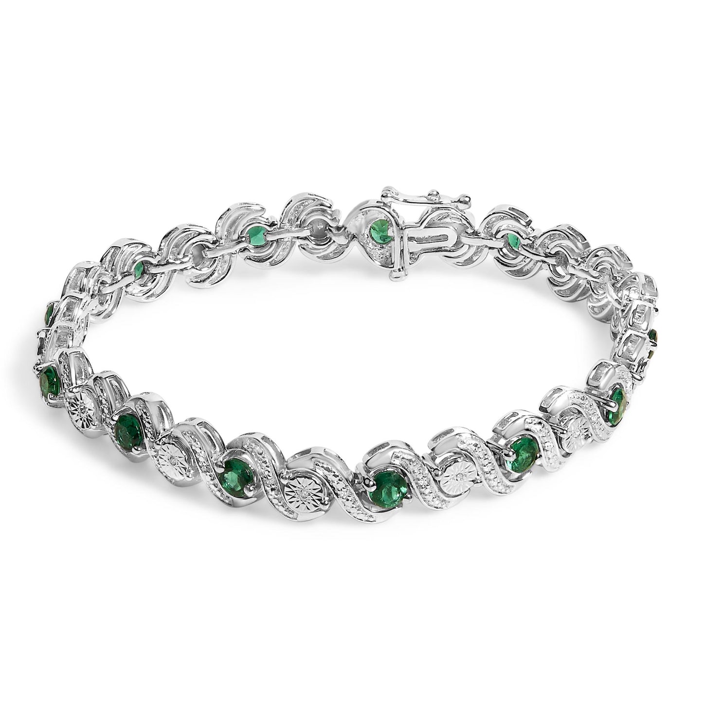 White bracelet with alternating round green gemstones set in prongs and round white gemstones in a miracle setting, shown from a top angle on a white background.