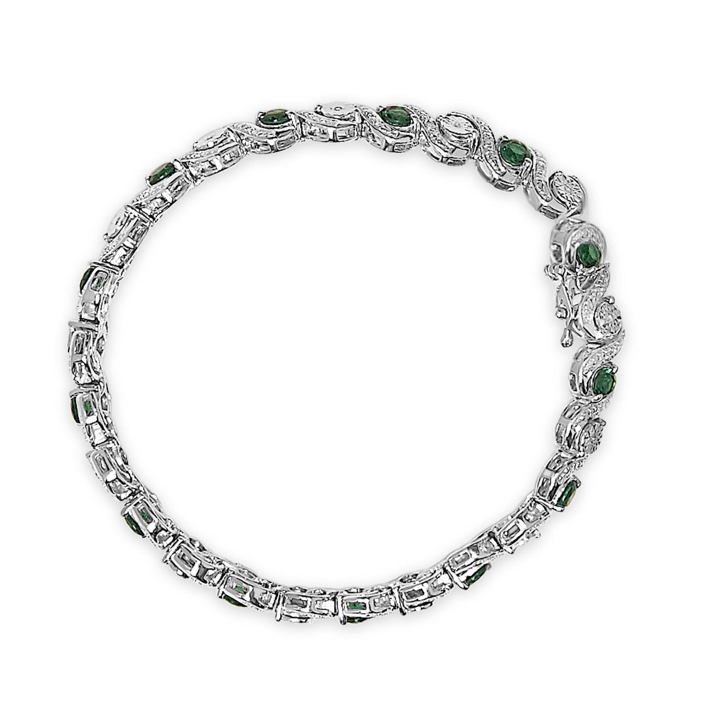 Top-down view of a white metal bracelet set with round white gemstones in a miracle setting and round green gemstones in a prong setting, arranged in a linked design.