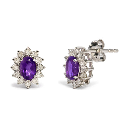Sterling Silver 1/8 Cttw Diamond Starburst Oval Amethyst Stud Earrings