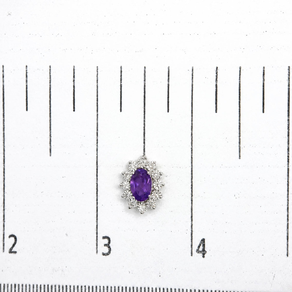 Sterling Silver 1/8 Cttw Diamond Starburst Oval Amethyst Stud Earrings