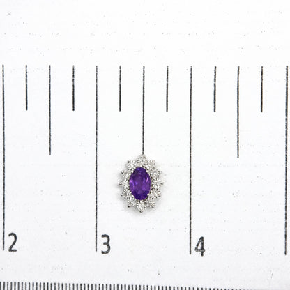 Sterling Silver 1/8 Cttw Diamond Starburst Oval Amethyst Stud Earrings