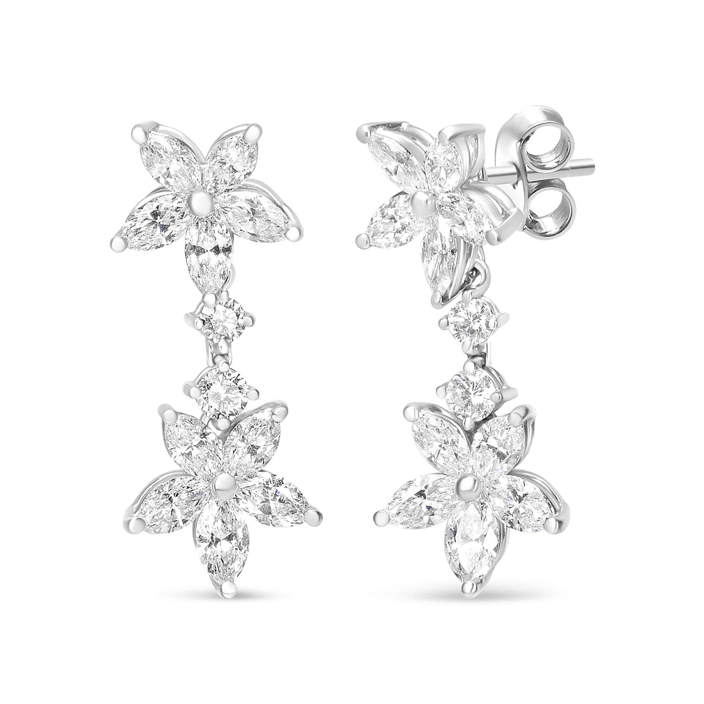 Front angle view of white metal floral-shaped earrings with marquise and round white gemstones in prong settings.
