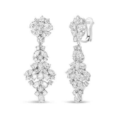Front and side views of white metal drop earrings featuring multiple white gemstones in marquise, oval, round, and pear shapes in prong settings.