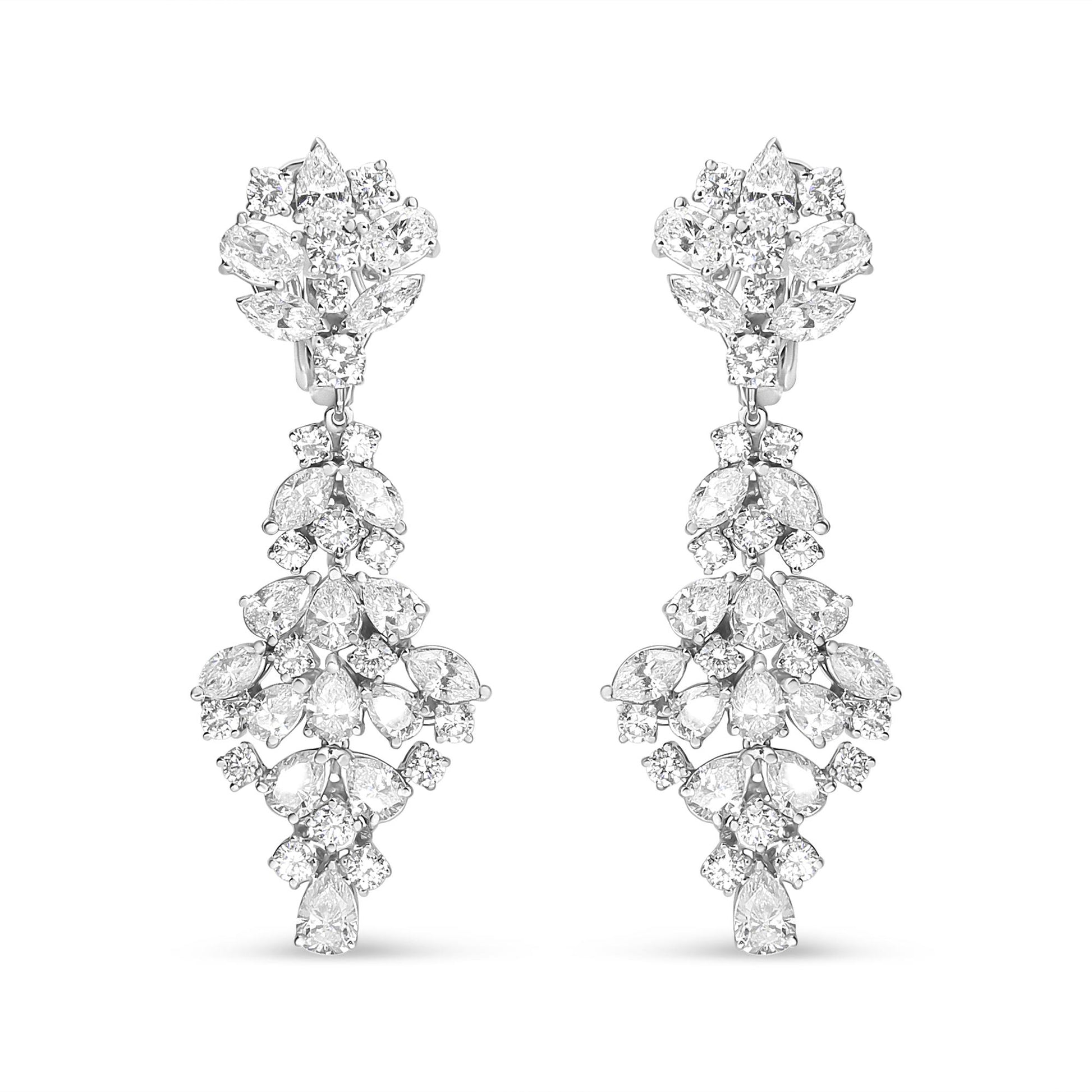 Front-facing view of white metal drop earrings featuring an intricate arrangement of marquise, oval, round, and pear-shaped white gemstones in prong settings.