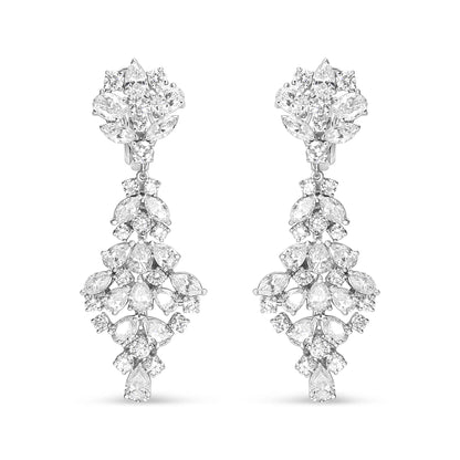 Front-facing view of white metal drop earrings featuring an intricate arrangement of marquise, oval, round, and pear-shaped white gemstones in prong settings.