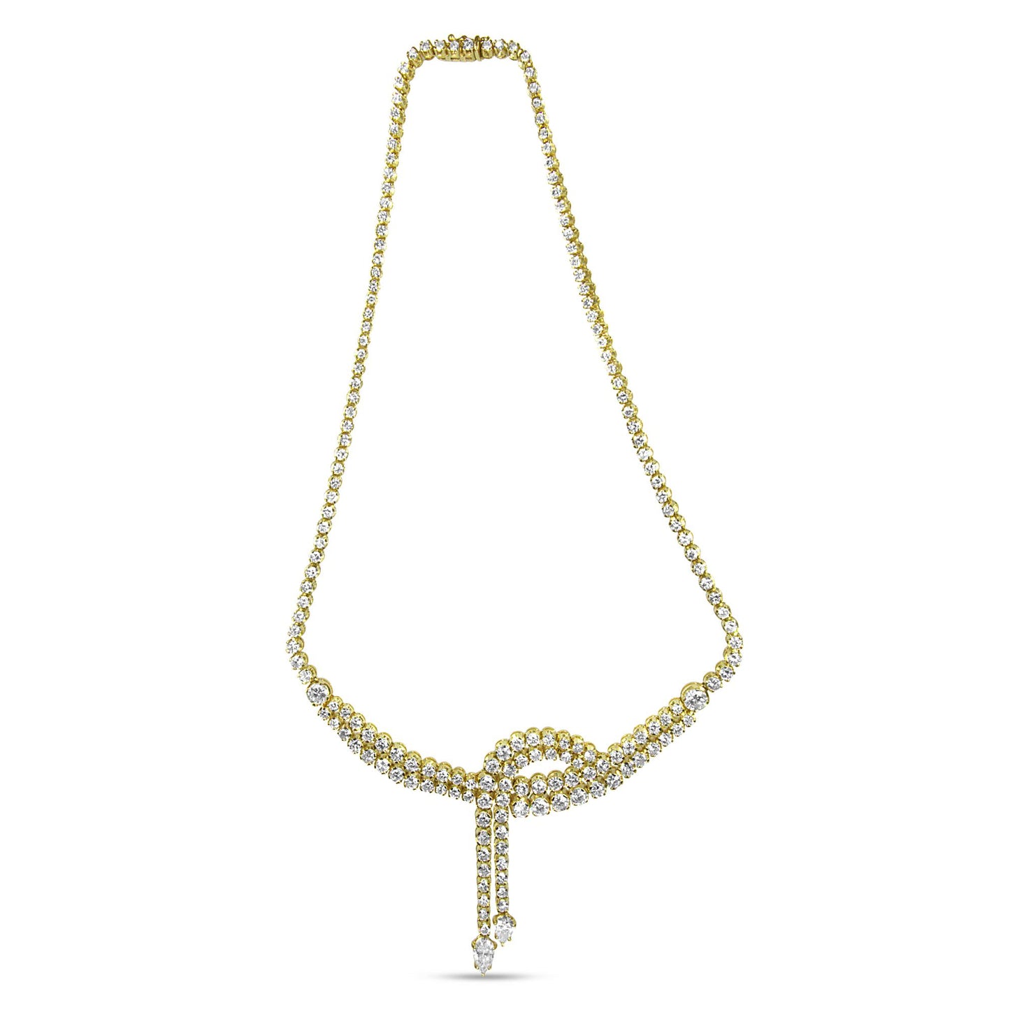 Front-facing shot of a yellow metal necklace with white round and pear-shaped gemstones arranged in a looped design with two dangling strands ending in pear-shaped gemstones.