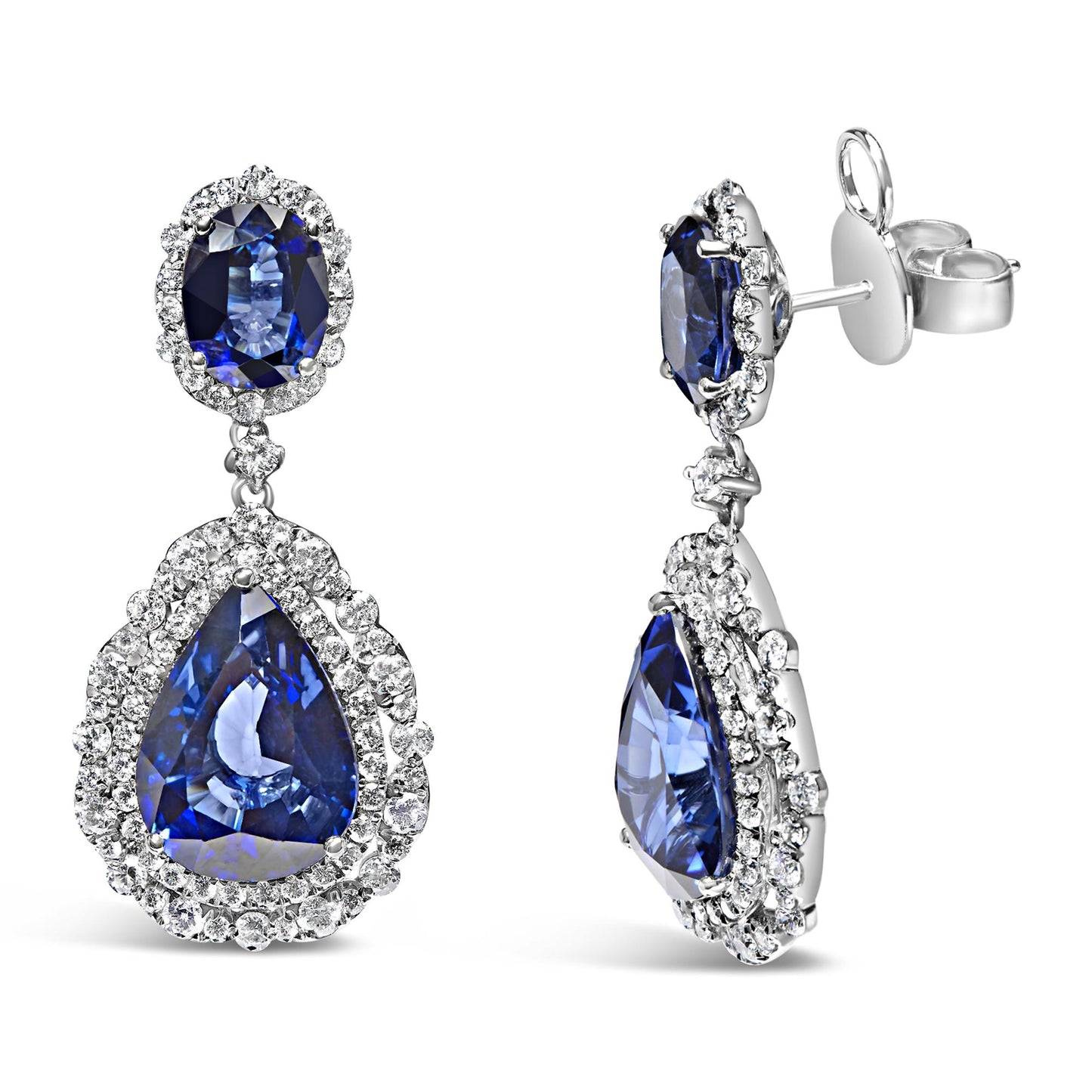 Pair of white metal drop earrings shown from front and side angles, featuring oval and pear-shaped blue gemstones surrounded by multiple round white gemstones in prong settings.