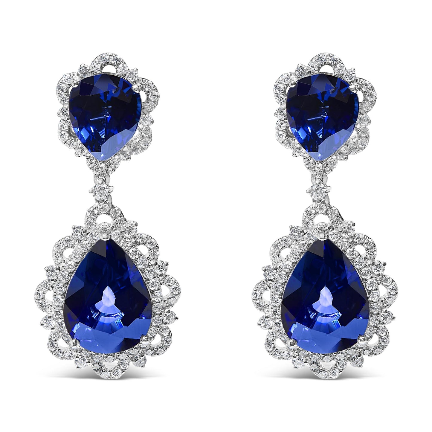 Pair of white metal drop earrings with pear-shaped blue gemstones surrounded by multiple small round white gemstones, shown in a front-facing view on a white background.