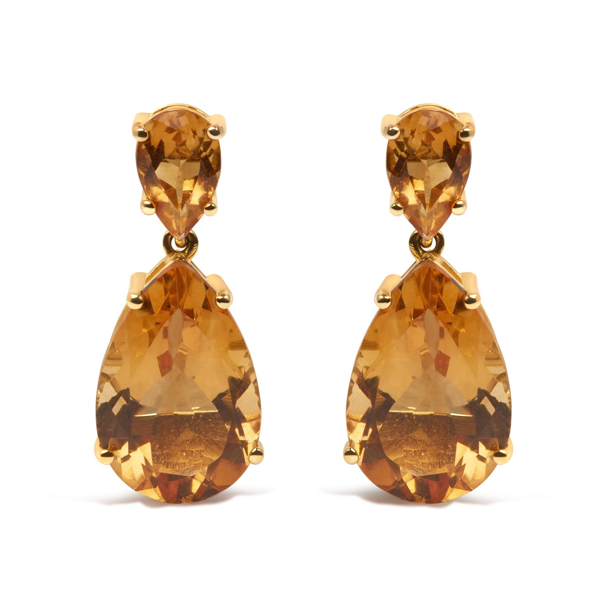 Front view of yellow metal earrings with pear-shaped orange gemstones in a two-tiered design.