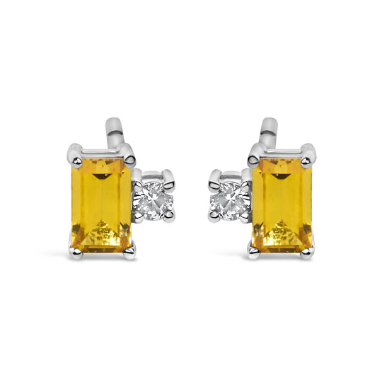 Front view of sterling silver stud earrings showcasing rectangular yellow gemstones and clear accent stones on a white background