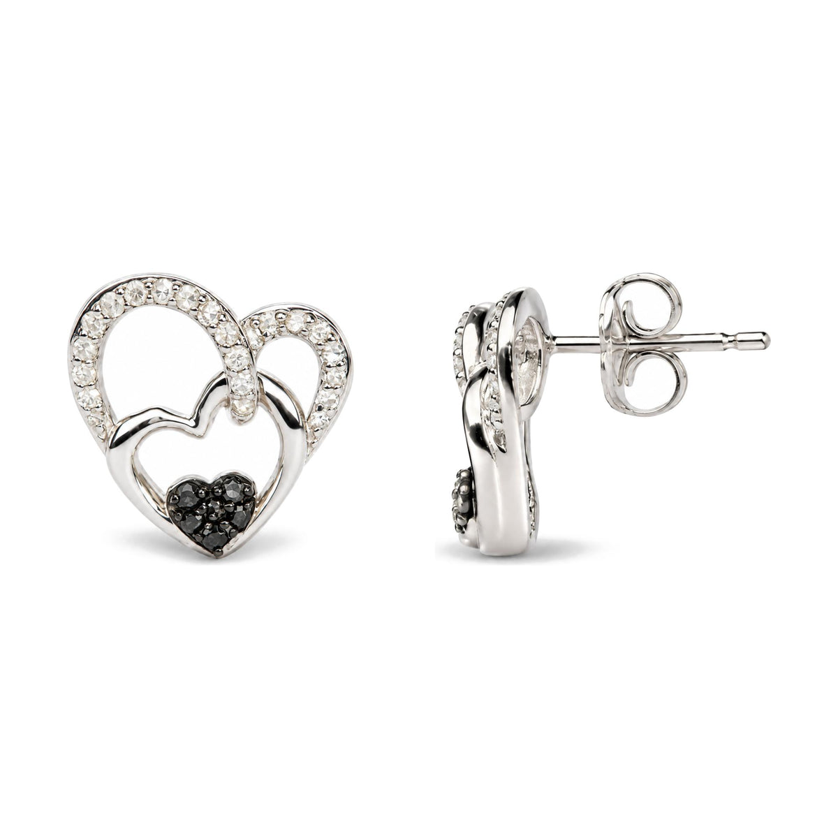 Close-up front and side view of white metal heart-shaped stud earrings, detailed with white and black round gemstones in prong settings.