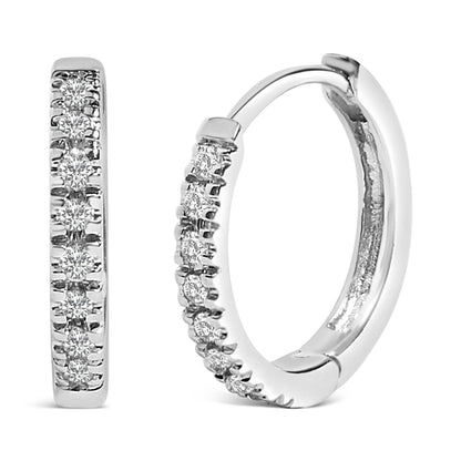 Close-up front and side view of white metal hoop earrings with multiple round white gemstones set in a row along the outer edge.