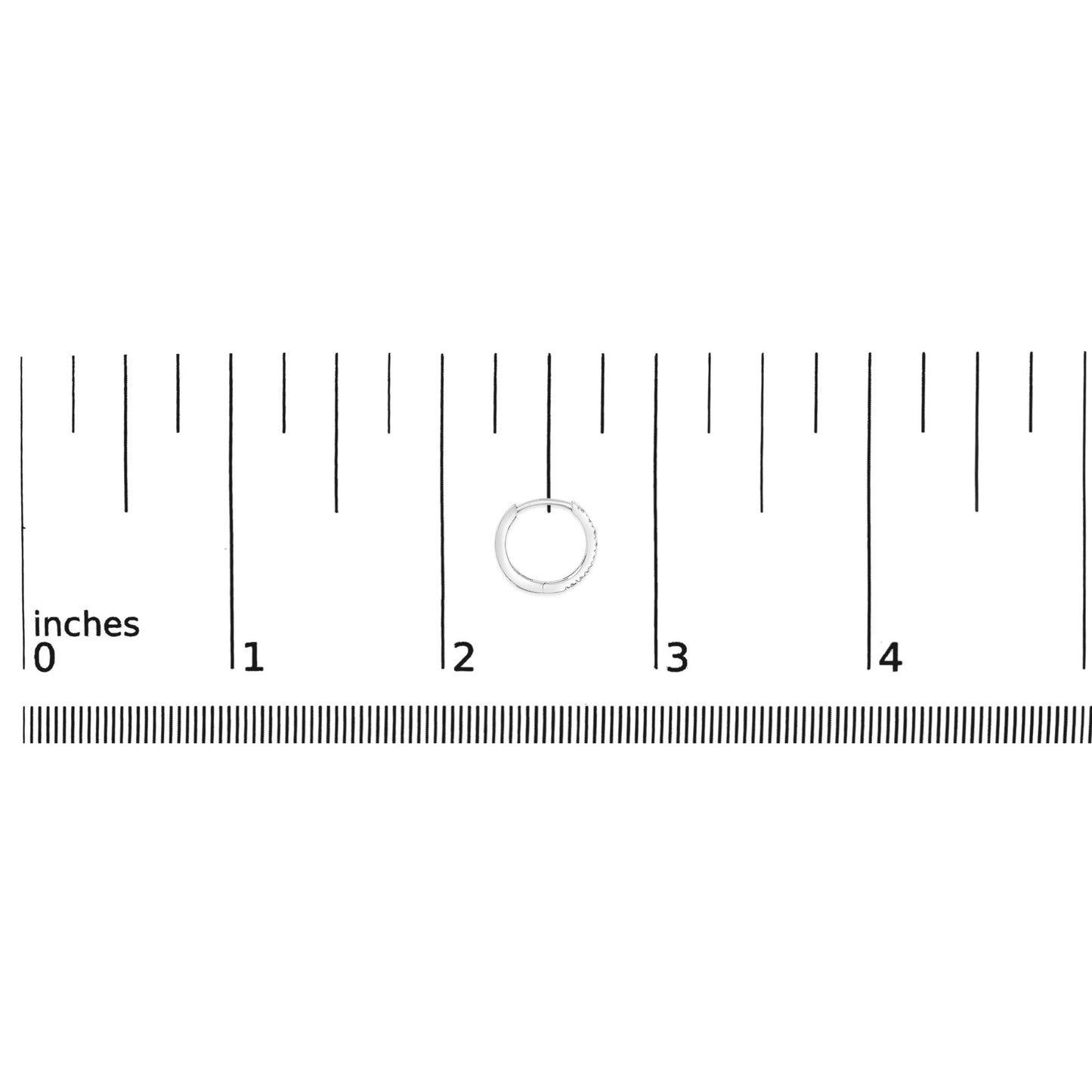 Close-up of a white hoop earring with small round white gemstones in 4-prong settings, shown on a ruler scale from a top-down angle.