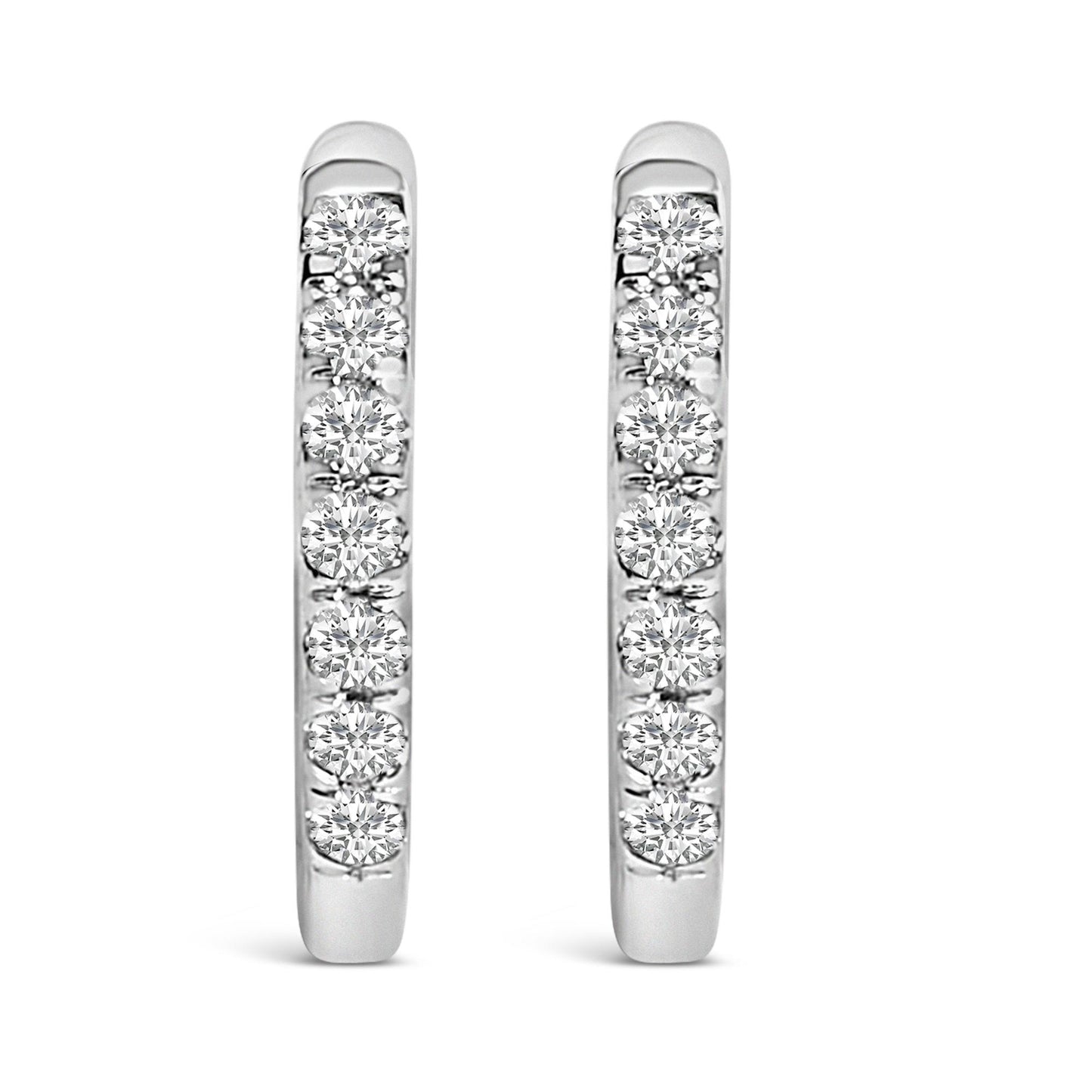 Front view of a pair of white metal hoop earrings each set with multiple round white gemstones in shared prong settings.