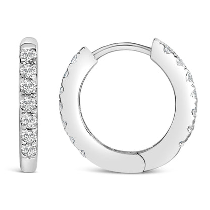Close-up front and side views of white hoop earrings set with round white gemstones in shared prong setting.