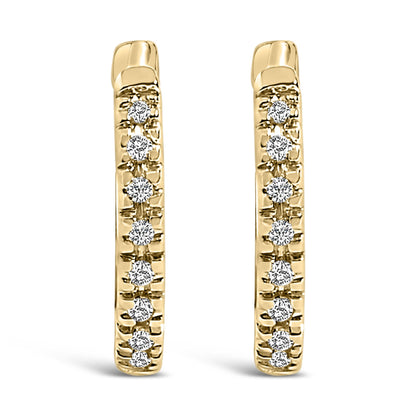 Front-facing close-up of a pair of yellow metal hoop earrings set with round white gemstones in a vertical line.