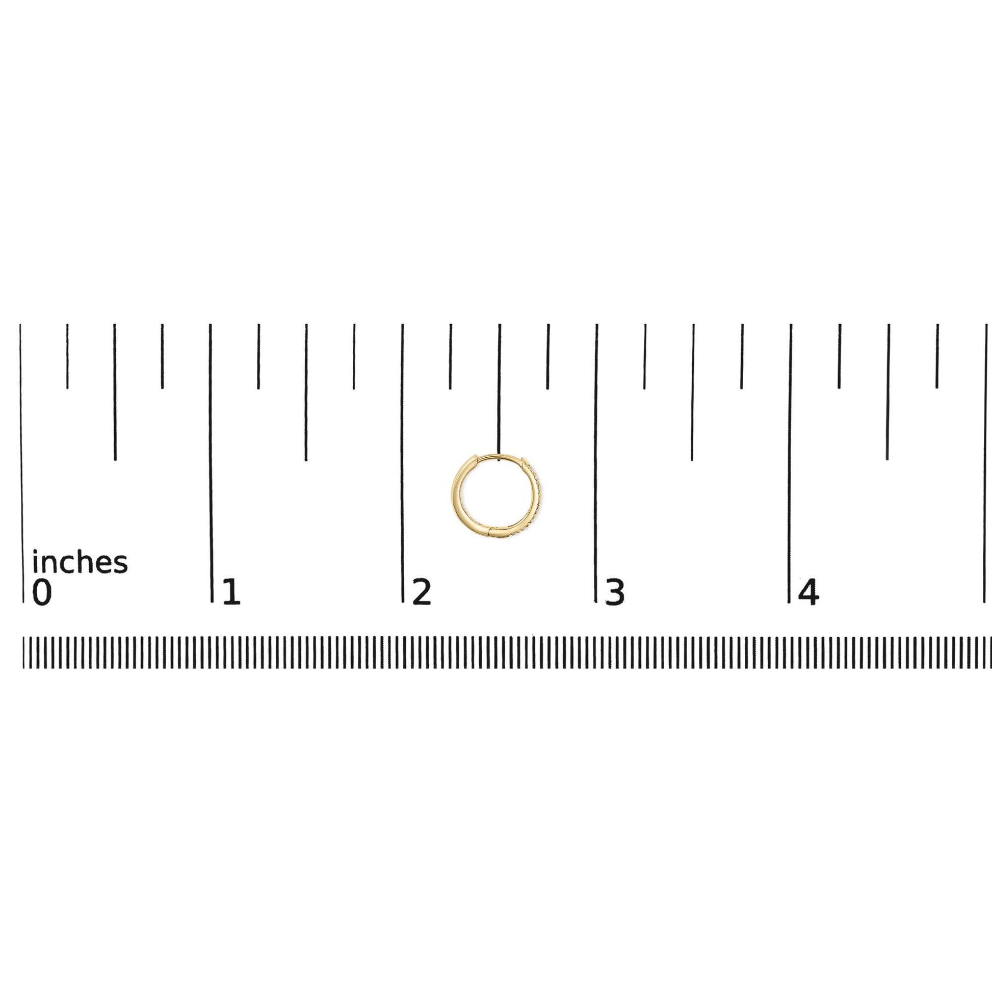 Close-up top view of a small yellow hoop earring partially adorned with round white gemstones, shown on a scale with inch measurements.