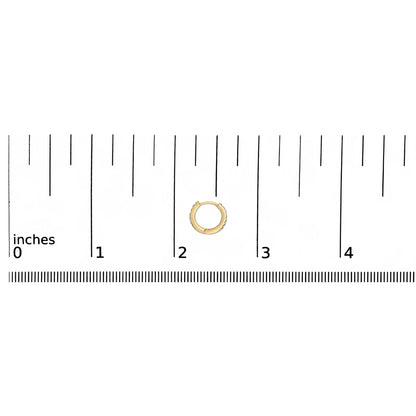 Yellow hoop earring with white round gemstones in shared prong setting, shown on a ruler scale from a top-down angle.