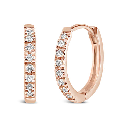 Pair of rose-colored hoop earrings with white round gemstones set along the front, shown from a slightly angled front view.